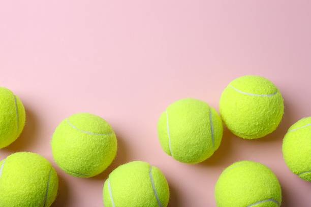 istock Tennis balls on pink surface 2248229262