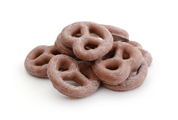 istock Chocolate covered pretzels isolated on white. 2248229968
