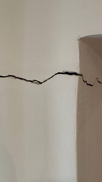 istock Crack on wall with texture, suitable as background or concept for damage and repair themes 2248236442