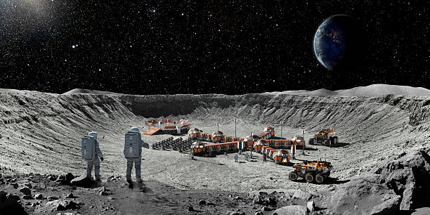istock Two Astronauts On Moon Looking At Moon Base From Crater Edge 2248236474