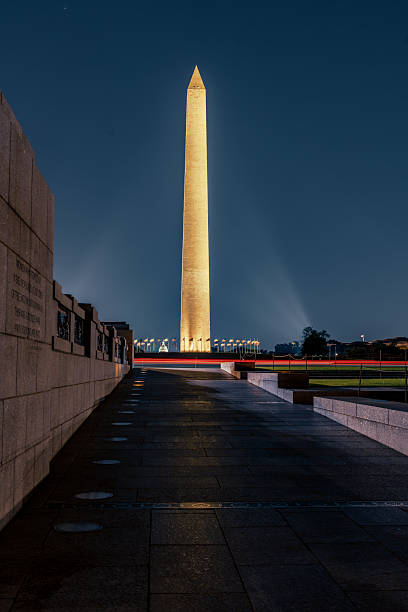 istock Washington Monument illuminated at night with light beams. 2248239360