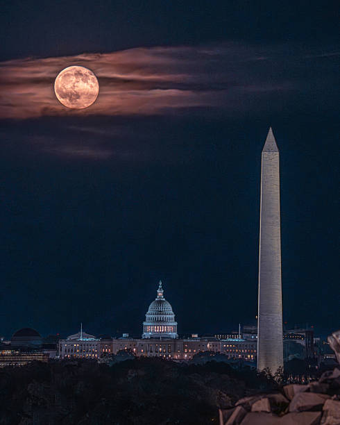 istock Full moon rises behind Washington Monument and Capitol 2248239499