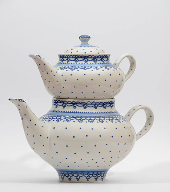istock A pair of elegant blue-and-white ceramic teapots stacked together 2248240239