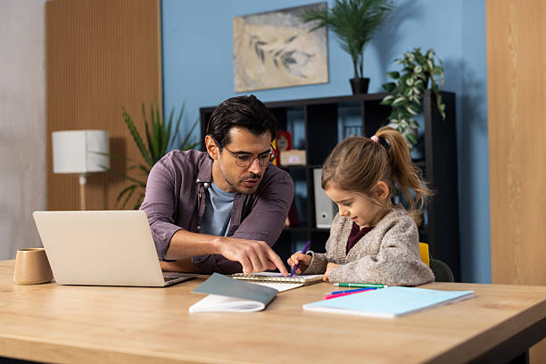 istock Father teaching daughter how to draw at home 2248241910