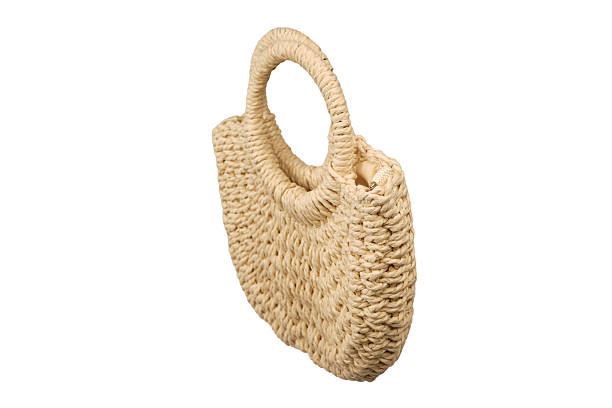 istock A beige straw bag isolated on a white background. 2248248366