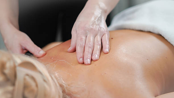 istock Gentle massage movements supporting relaxation of blonde client in spa 2248249534