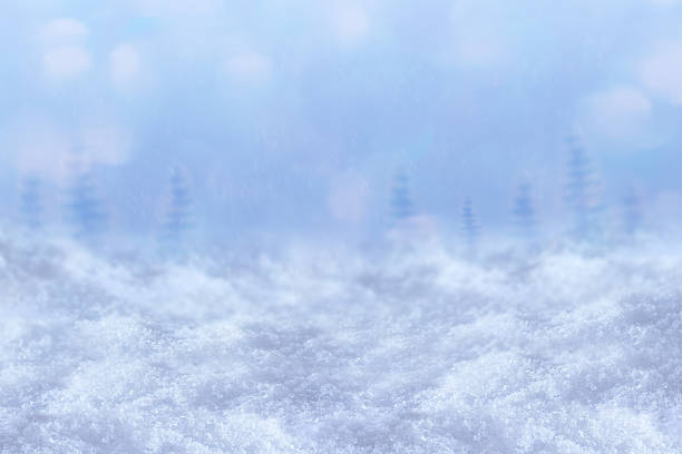 istock snow on winter background with Christmas trees 2248249960