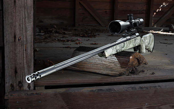 istock Bolt action rifle in a broken down building 2248250371