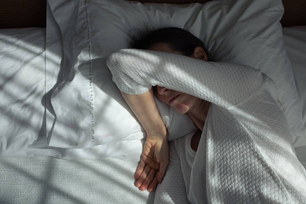 istock Woman suffering from sleep apnea. Sleep disorder. 2248254040