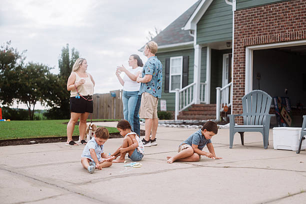 istock Kids Playing With Chalk During Outdoor Neighbor Gathering 2248254834