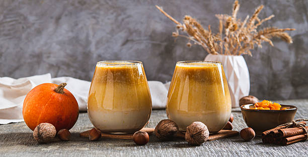 istock Warming pumpkin nut latte in glasses on the table web banner 2248256612