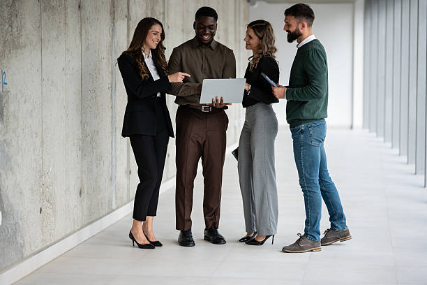 istock Diverse business people discussing during office hallway meeting 2248260042