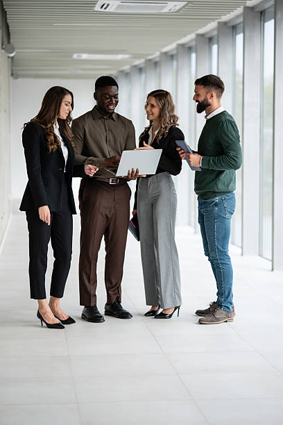 istock Diverse business team collaborating on project in modern office 2248260082