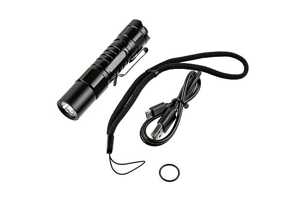 istock A tactical flashlight set including a black LED torch, USB cable, wrist strap, and O-ring. 2248261958