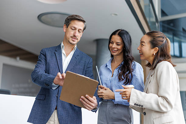 istock Business colleagues collaborating on project in modern office 2248265142