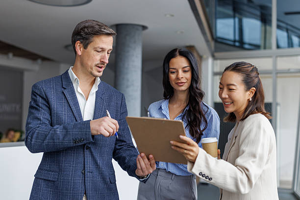 istock Business colleagues collaborating on document in modern office 2248265181
