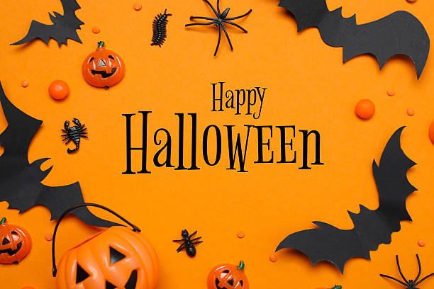 istock Holiday card for Halloween. Different decorations including pumpkins, spiders, bats on orange background 2248266369