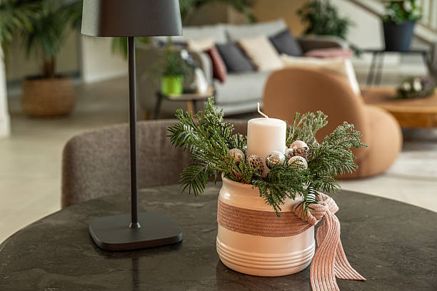istock Christmas candle centerpiece with greenery in hotel lobby 2248266638