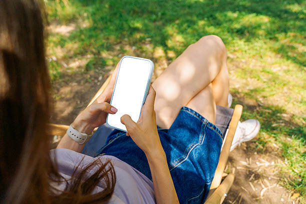 istock Woman Using Smartphone with Blank Screen Outdoors 2248266717