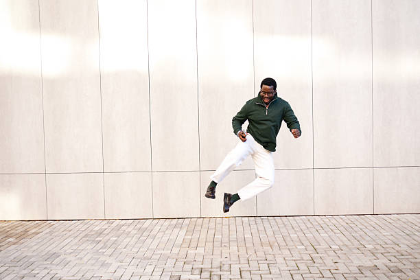 istock Happy black man jumping expressing joy and freedom 2248267795