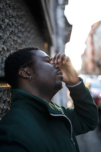 istock Stressed mid adult man experiencing headache in city 2248267857