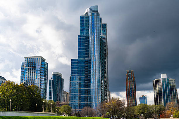 istock Architectural building in business district. Park and skyscraper cityscape. City architecture. Architecture building. City skyscraper. Business skyscraper building. Urban skyline and autumn park 2248268342
