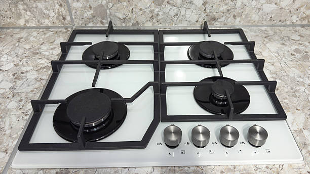 istock Modern gas stovetop with four burners and metal control knobs installed on a marble countertop, representing home interior design, kitchen technology, and modern lifestyle concepts 2248268680