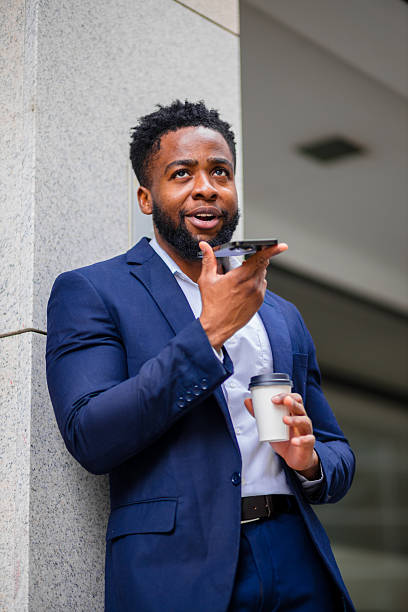 istock Young businessman on speakerphone outdoors 2248269748