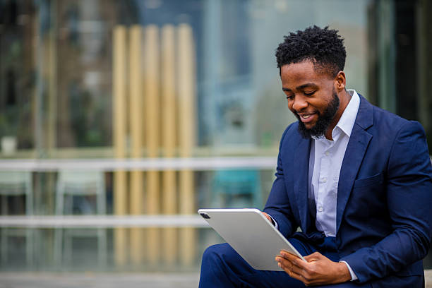istock Young businessman working on tablet outdoors 2248269752