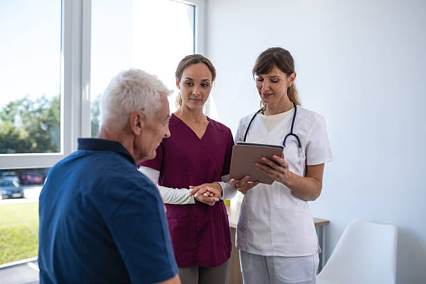 istock Physiatrist And Physiotherapist With Patient In Physiotherapy 2248269810