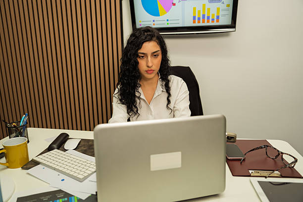 istock Professional businesswoman analyzing data working on laptop in office 2248269946