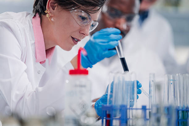 istock Scientist wearing safety glasses analyzing chemical samples in laboratory 2248270109