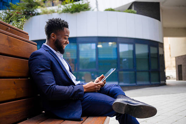 istock Black entrepreneur reviewing digital project outside 2248270229