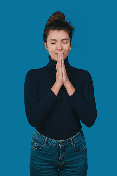istock female individual immersed in introspective practice with gentle studio lighting and focus 2248270578