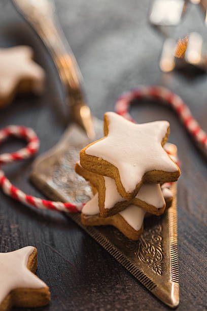 Star shaped raw cookies ready to bake. Baking sheet uncooked biscuits homemade cakes and ingredients on kitchen table. Homemade food preparing process. Household housewife housework concept