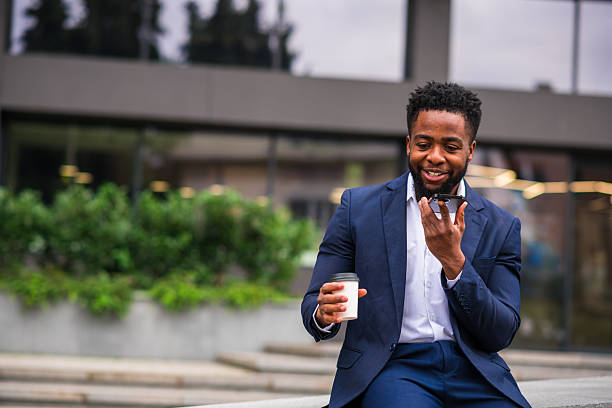 istock Young entrepreneur on outdoor speakerphone call 2248271567