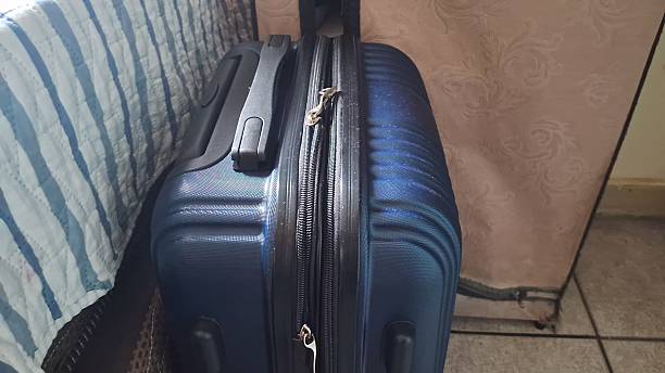 istock Suitcase by the bed, ready for a trip 2248273173