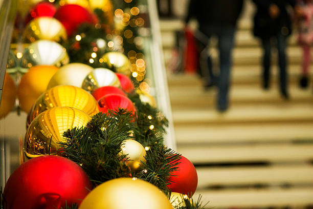 Preparing for Christmas holidays, interior photo with red, yellow and gold new year's balls, garland and decorative objects