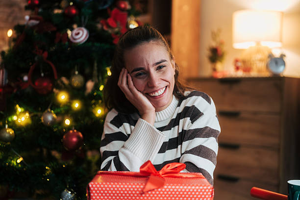 istock Happy woman smiling looking at camera during christmas holidays 2248278270