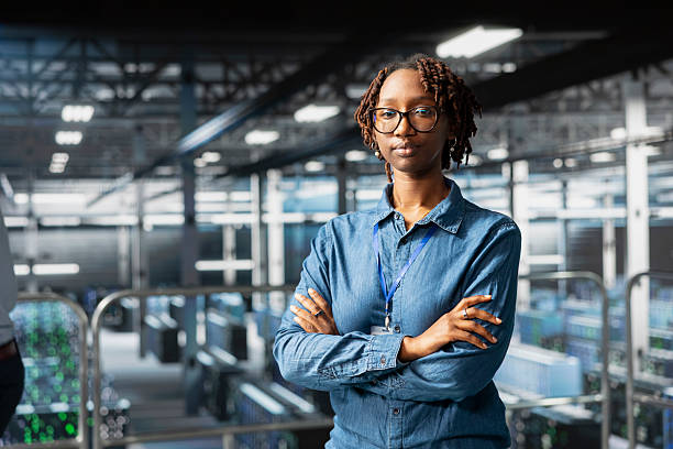 istock Portrait of smiling african american engineer running diagnostics on AI tools 2248279466