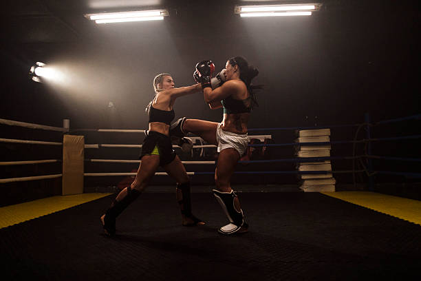 istock Female boxers collide in ring during intense sparring 2248280877