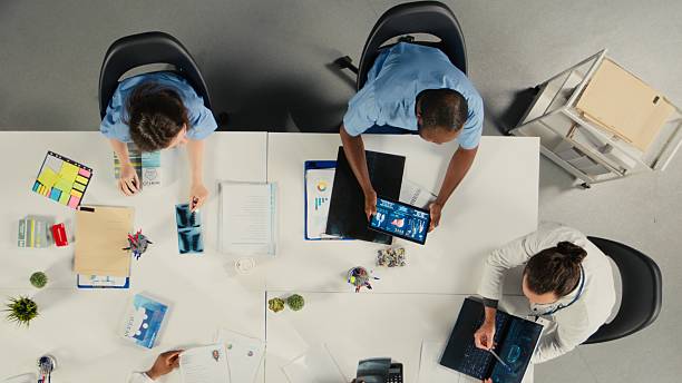 istock Top down view of surgeons staff in a clinic discussing therapy options 2248281420