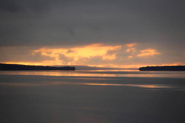 Annapolis Royal, Nova Scotia, Canada - November 2025: View on the sunset in the Bay of Fundy taken from Annapolis Royal, formerly known as Port Royal, Annapolis Royal has one of the oldest histories in North America. It was also Acadia's (and Nova Scotia's) capital. It is a National Historic Site of Canada. This picture was taken in late fall of 2025.