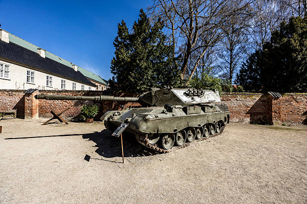 Tracks and wheels of a tank covered with a protective sheet