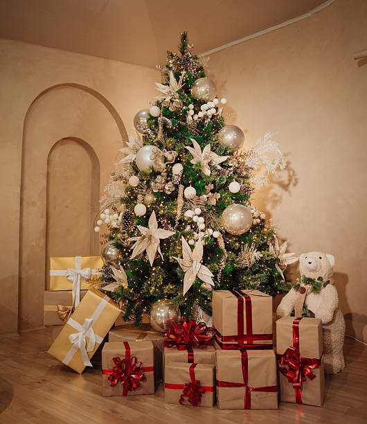 istock Christmas tree with gifts and lights inside a house 2248284133