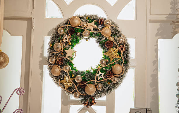 istock Christmas wreath hanging on the door 2248284513