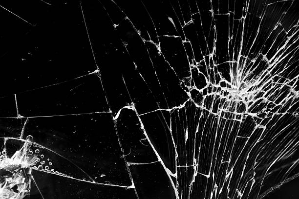 istock cracked glass isolated in black background 2248285381