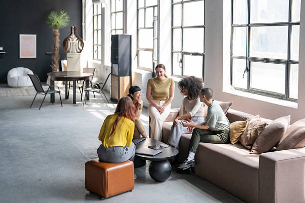 istock Female coworkers chatting together during a break in a modern office 2248285389