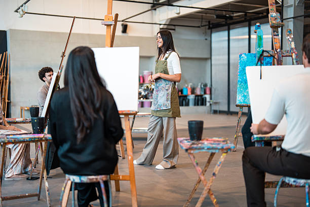 istock Young Middle Eastern Art Teacher Leading Interactive Painting Class in Bright Modern Studio 2248286736