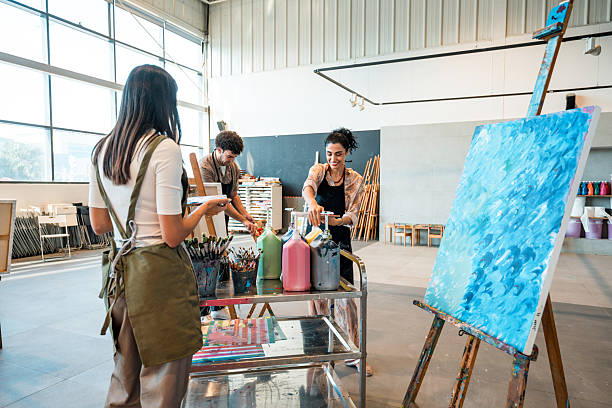 istock Diverse Group in Art Studio Engaged in Creative Painting Activity 2248286754